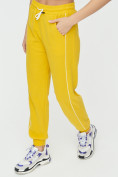 Оптом Спортивные брюки женские желтого цвета 1306J в Екатеринбурге, фото 12