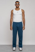 Оптом Широкие спортивные штаны трикотажные мужские синего цвета 12903S в Томске