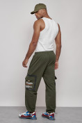 Оптом Широкие спортивные брюки трикотажные мужские цвета хаки 12908Kh в  Красноярске, фото 5