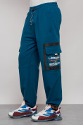 Оптом Широкие спортивные брюки трикотажные мужские синего цвета 12908S в Саратове, фото 10