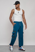 Оптом Широкие спортивные брюки трикотажные мужские синего цвета 12908S в Оренбурге, фото 24