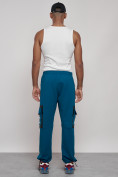 Оптом Широкие спортивные брюки трикотажные мужские синего цвета 12908S в Омске, фото 4