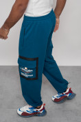 Оптом Широкие спортивные брюки трикотажные мужские синего цвета 12908S в Омске, фото 6