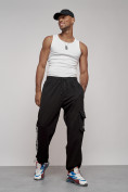 Оптом Широкие спортивные брюки трикотажные мужские черного цвета 12910Ch