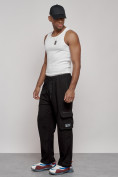 Оптом Широкие спортивные брюки трикотажные мужские черного цвета 12910Ch в Перми, фото 5