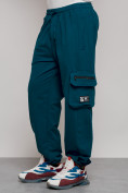 Оптом Широкие спортивные брюки трикотажные мужские синего цвета 12910S в Уфе, фото 10