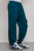 Оптом Широкие спортивные брюки трикотажные мужские синего цвета 12910S в Перми, фото 11
