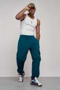 Оптом Широкие спортивные брюки трикотажные мужские синего цвета 12910S в Перми, фото 19