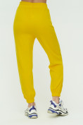 Оптом Штаны джоггеры женские желтого цвета 1302J в Перми, фото 9