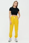 Оптом Спортивные брюки женские желтого цвета 1306J, фото 2