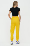 Оптом Спортивные брюки женские желтого цвета 1306J, фото 5