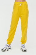 Оптом Спортивные брюки женские желтого цвета 1306J, фото 6