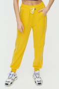 Оптом Спортивные брюки женские желтого цвета 1306J в Перми, фото 11