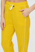 Оптом Спортивные брюки женские желтого цвета 1306J, фото 16