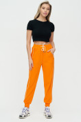 Оптом Спортивные брюки женские оранжевого цвета 1306O в Перми