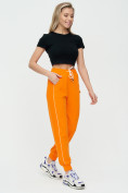 Оптом Спортивные брюки женские оранжевого цвета 1306O в Перми, фото 3