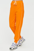Оптом Спортивные брюки женские оранжевого цвета 1306O в  Красноярске, фото 8