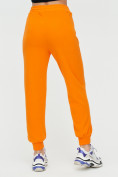 Оптом Спортивные брюки женские оранжевого цвета 1306O в Перми, фото 9