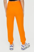 Оптом Спортивные брюки женские оранжевого цвета 1306O в Перми, фото 13