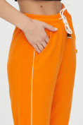 Оптом Спортивные брюки женские оранжевого цвета 1306O в Перми, фото 15