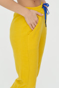 Оптом Спортивные брюки женские желтого цвета 1307J в Перми, фото 17
