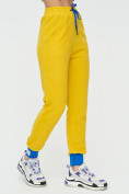 Оптом Спортивные брюки женские желтого цвета 1307J в  Красноярске, фото 8