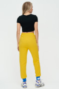 Оптом Спортивные брюки женские желтого цвета 1307J в Казани, фото 5