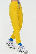 Оптом Спортивные брюки женские желтого цвета 1307J в Екатеринбурге, фото 9