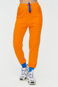 Оптом Спортивные брюки женские оранжевого цвета 1307O в Перми, фото 7