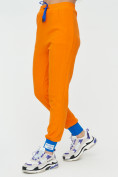 Оптом Спортивные брюки женские оранжевого цвета 1307O в Перми, фото 9