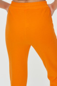 Оптом Спортивные брюки женские оранжевого цвета 1307O в Перми, фото 19