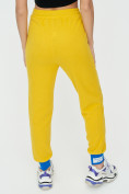 Оптом Спортивные брюки женские желтого цвета 1307J в  Красноярске, фото 14