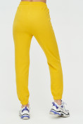 Оптом Штаны джоггеры женские желтого цвета 1312J в Перми, фото 11