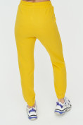 Оптом Штаны джоггеры женские желтого цвета 1312J в Перми, фото 16
