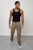 Оптом Джинсы карго мужские с накладными карманами бежевого цвета 2401B в Сочи, фото 10