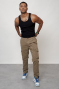 Оптом Джинсы карго мужские с накладными карманами бежевого цвета 2404B в Уфе, фото 9