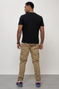 Оптом Джинсы карго мужские с накладными карманами бежевого цвета 2413B в Астане, фото 12