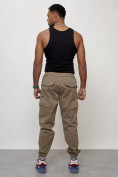 Оптом Джинсы карго мужские с накладными карманами бежевого цвета 2420B в Оренбурге, фото 4