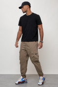 Оптом Джинсы карго мужские с накладными карманами бежевого цвета 2423B в Волгоградке, фото 10