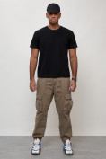 Оптом Джинсы карго мужские с накладными карманами бежевого цвета 2423B в Астане, фото 9