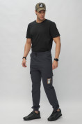Оптом Брюки джоггеры спортивные с карманами мужские темно-синего цвета 3075TS, фото 2