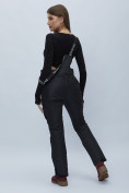 Оптом Полукомбинезон брюки горнолыжные женские черного цвета 55221Ch в Казани, фото 6