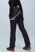Оптом Полукомбинезон брюки горнолыжные женские черного цвета 55221Ch в Казани, фото 9