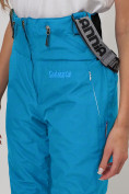 Оптом Полукомбинезон брюки горнолыжные женские голубого цвета 66789Gl в Казани, фото 10